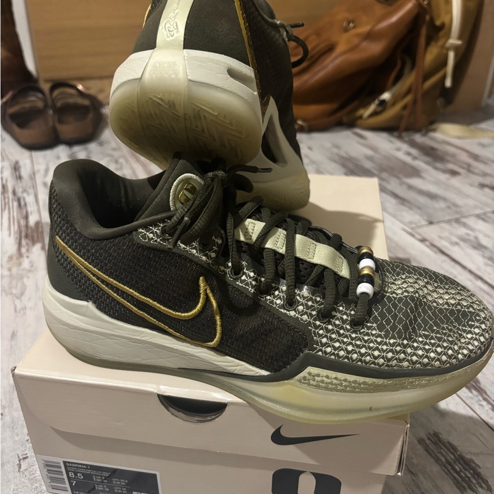 Nike Black and Gold Athletic Shoes with Mesh Design